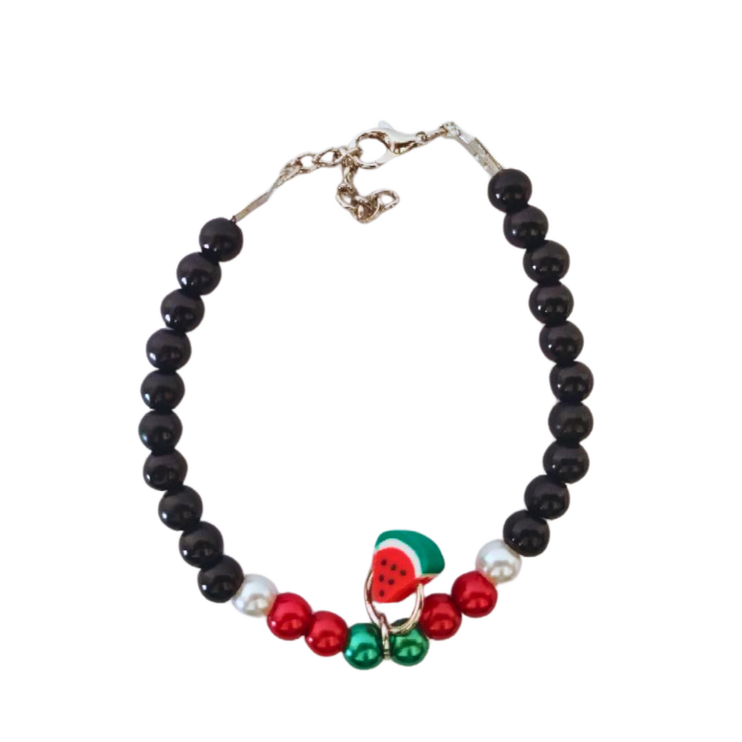 Front picture beaded bracelet with hint of red ,green and white beads and a watermelon charm on top